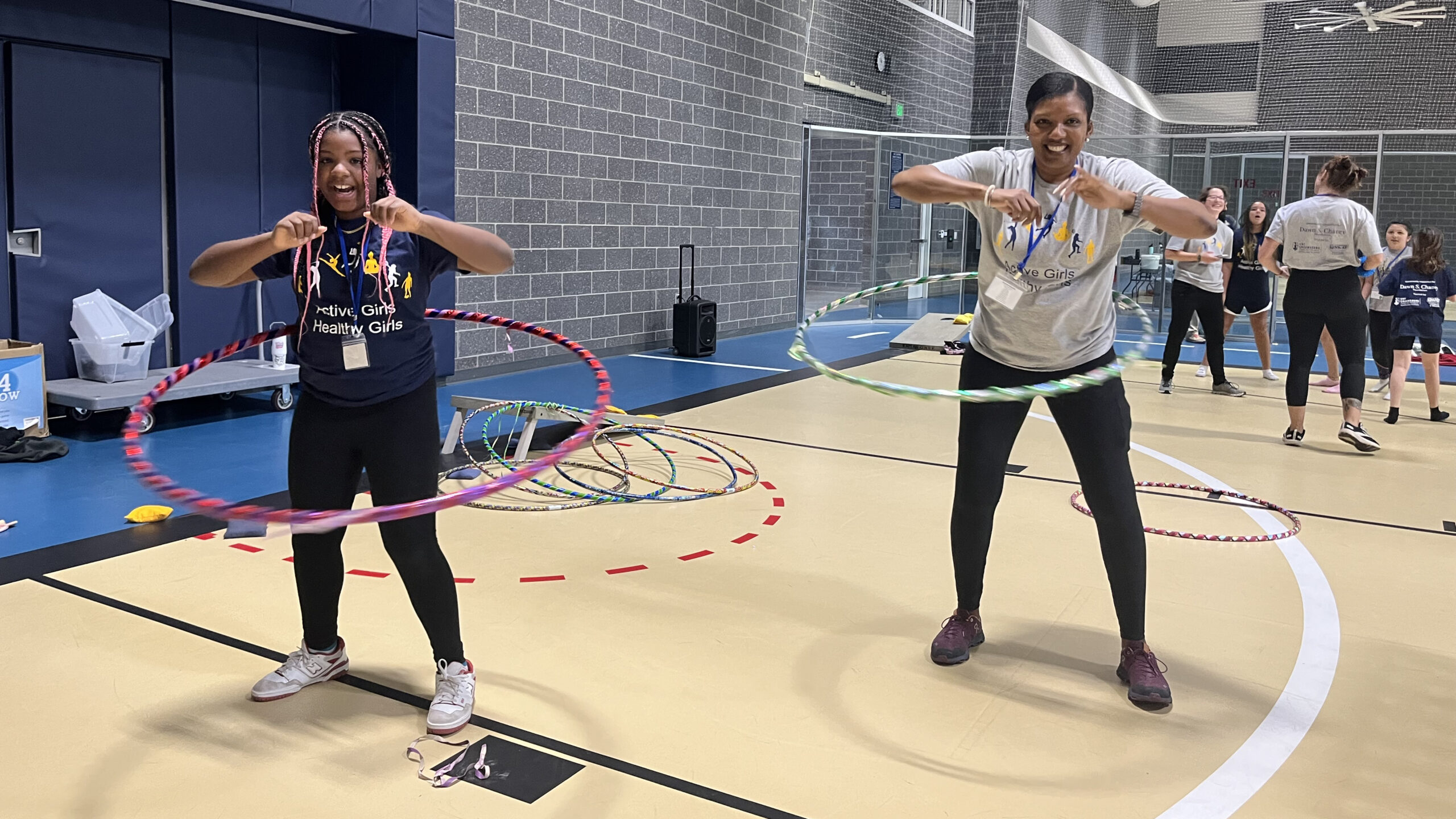 Two girls hula hooping