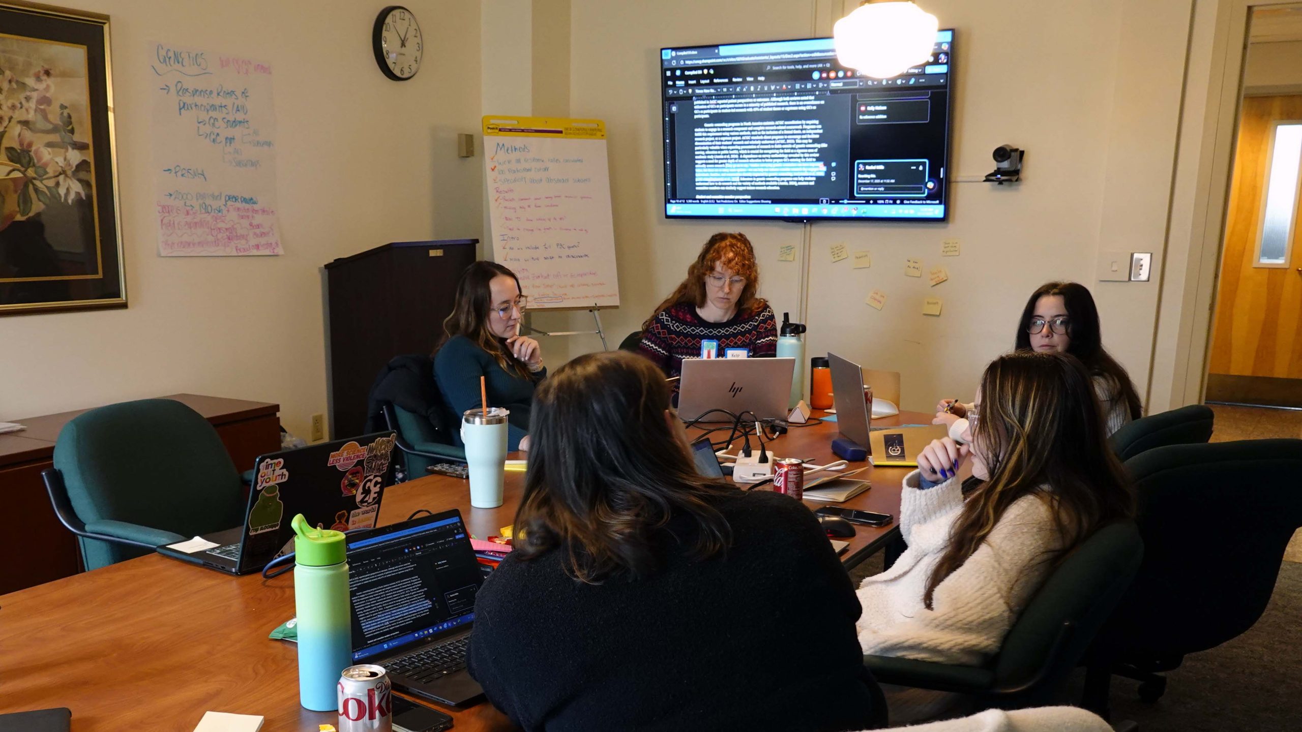 One of the teams woring on their manuscript