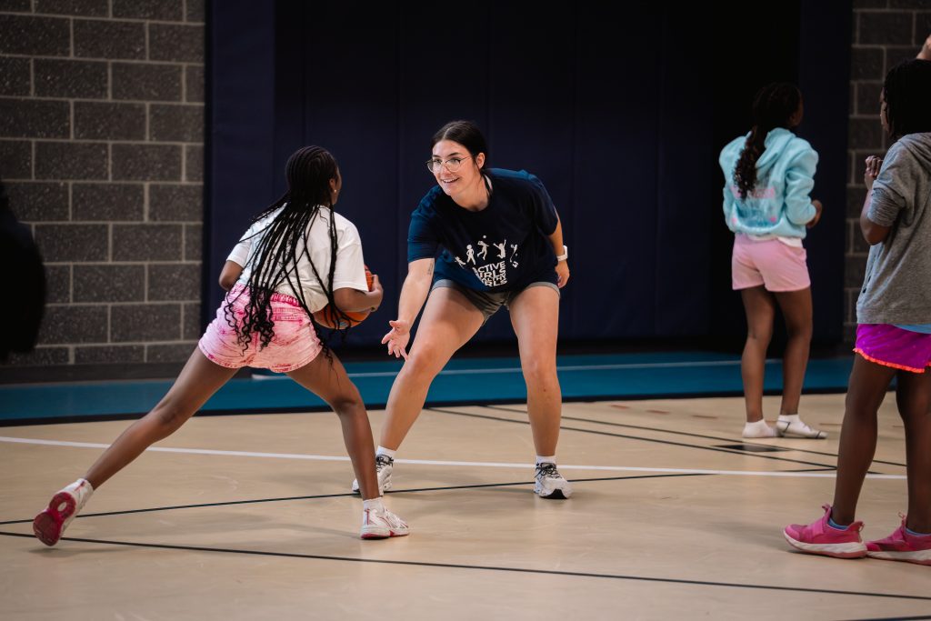 Active Girls Healthy Girls Camp, playing basketball.